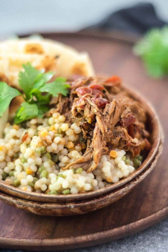PULLED BEEF OVER ISRAELI COUSCOUS 7" PAN